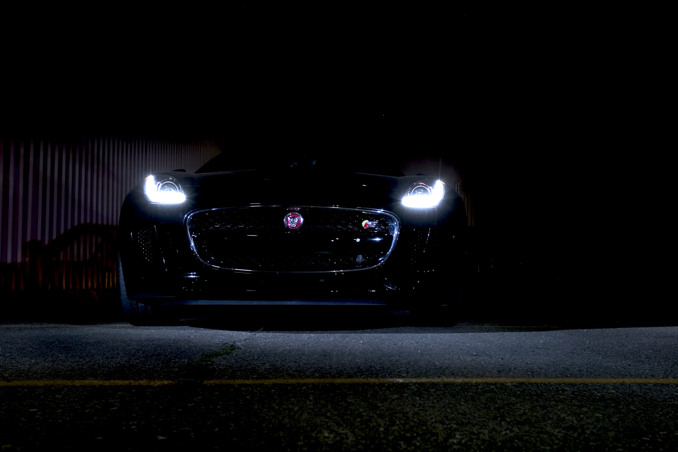 The F-type's high-intensity xenon headlights provide light for both low and high beams in a single unit, flanked by J-Blade LED running lights (Photo: Angus MacKenzie/Gizmag.com)