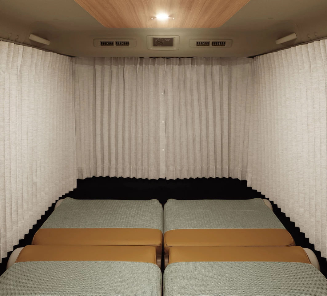 A retractable wraparound curtain separates the MyRoom cabin from the van cockpit and outer world