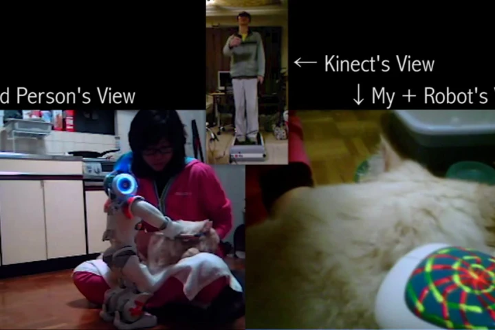 The teleoperation system created by Taylor Veltrop lets him remotely groom his cat