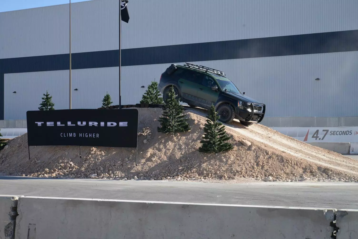 Kia seems quite eager to sell its new full-size Telluride SUV as a rugged, ready-for anything utility vehicle; the model will debut in full next year