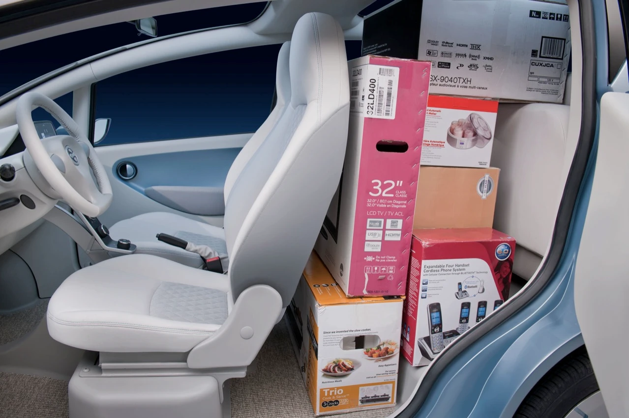 The Tata eMO's back seats fold up to allow for more cargo space