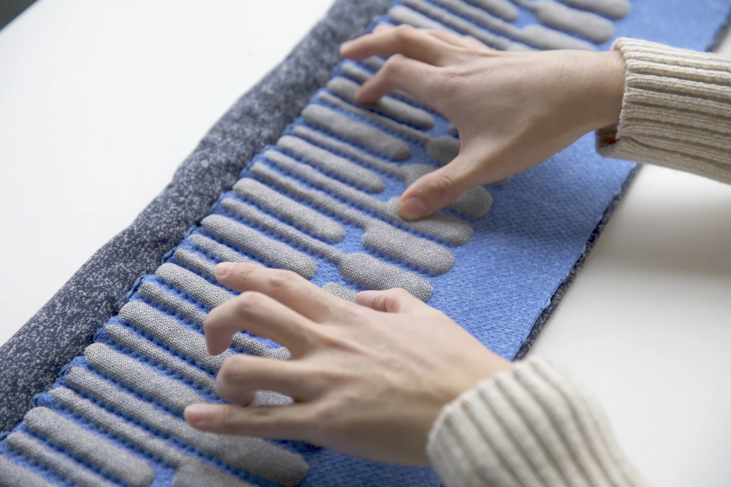 The KnittedKeyboard II can sense physical contact and gestures in the air