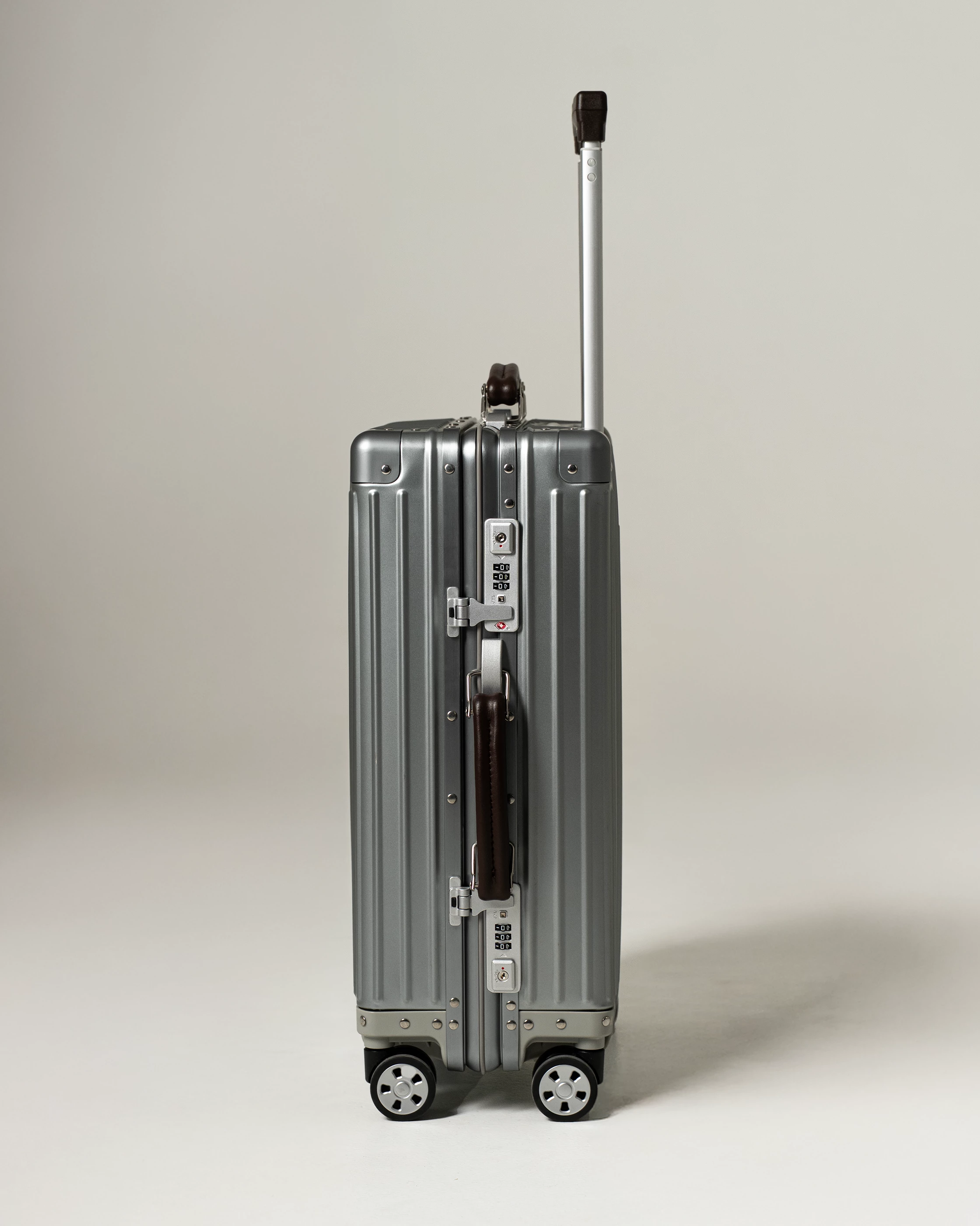 The tough titanium shell comes with luxury leather handles for comfort