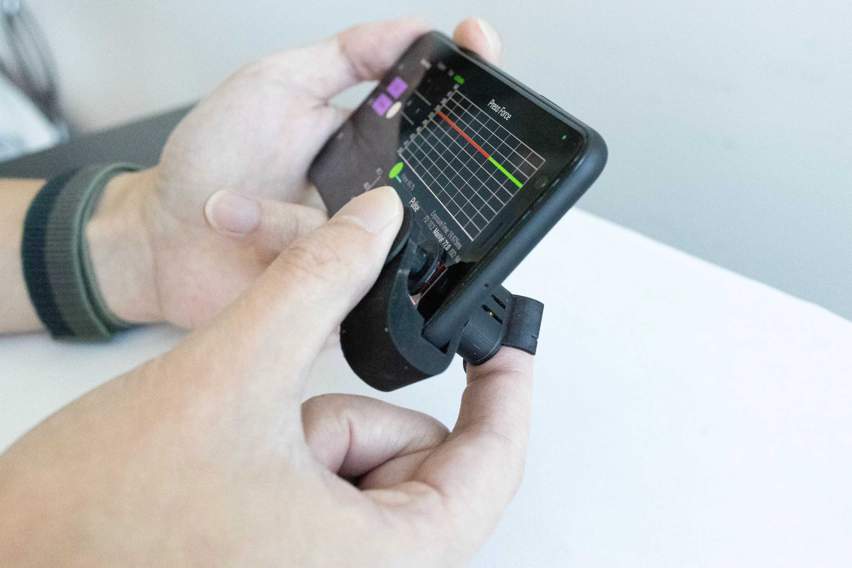 Clipped onto a regular smartphone, the device works with an app to measure systolic and diastolic blood pressure