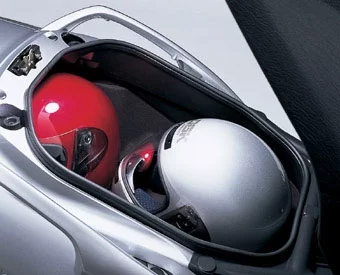 One of the best things about the Burgman is its luggage and storage capacity: the under-seat storage compartment measures a full 56 litres, which is plenty large enough for most commuting and day trips. The great thing about the design is that you can take out your books/bag etc and leave two full-face helmets inside.