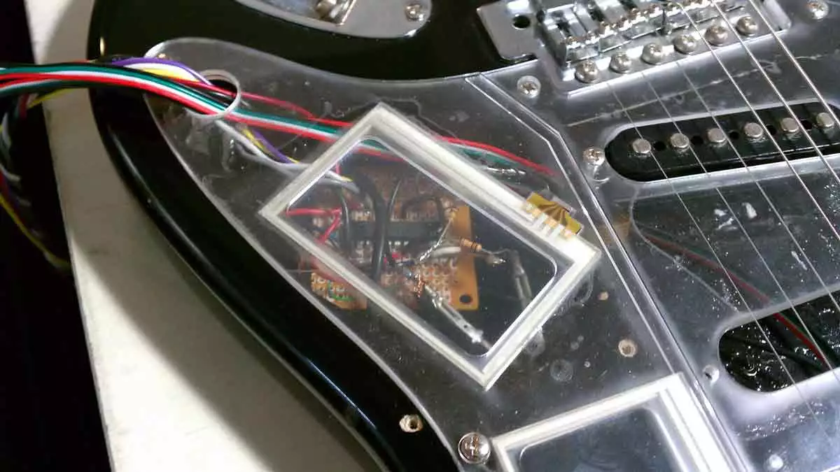 A transparent pick guard shows the system behind the touch wizardry