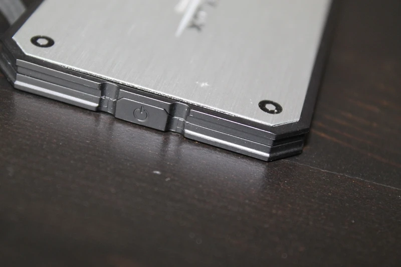 A power button turns the device on to begin charging a connected device
