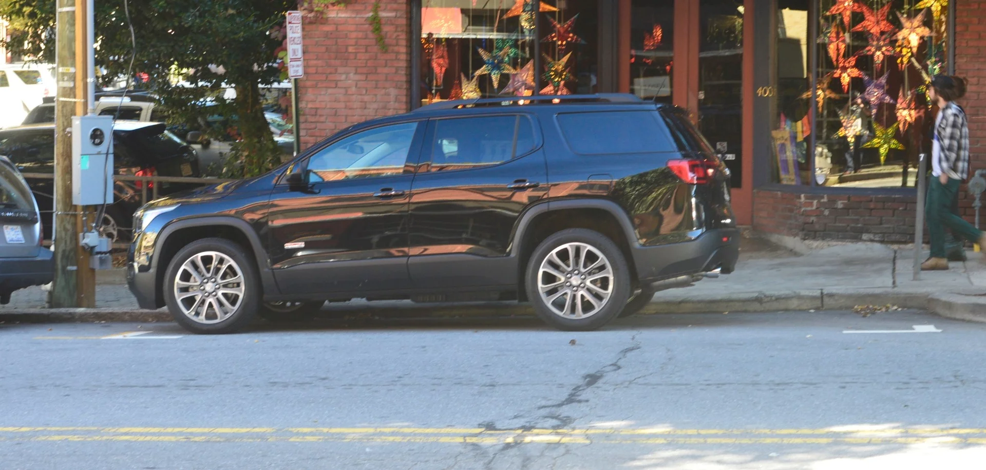 The Acadia maneuvered well enough to make this parallel park job a breeze. We should have backed up a little more, though