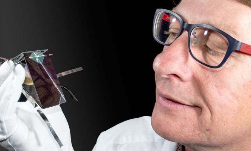 Dr. Keevers from the University of New South Wales with the cell that broke the record for converting sunlight to electricity in 2016