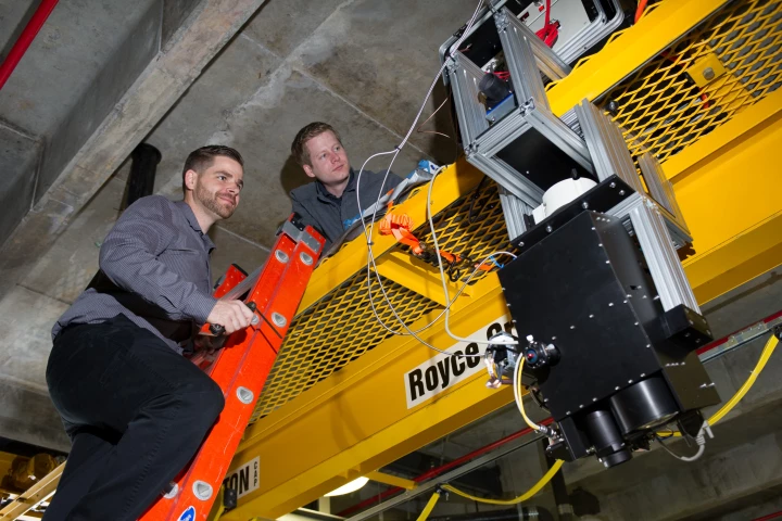 The gantry-mounted prototype device is moved over a pool, to simulate being flown over the sea in an aircraft (Photo: Georgia Tech)