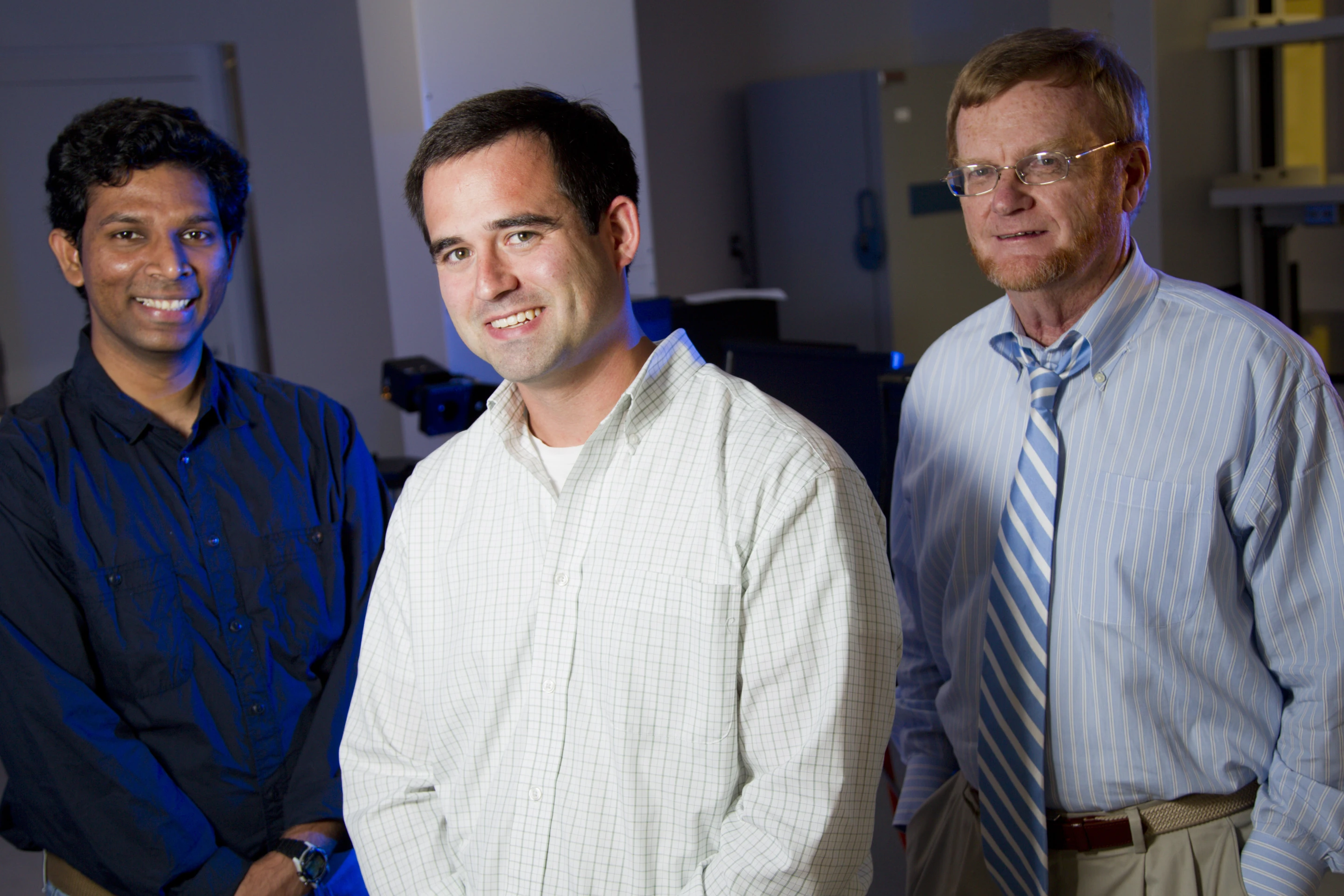 Antibacterial coating inventor Jason Locklin is surrounded by his project team; (left) Vikram Dhende, graduate student, and (right) Ian Hardin, a professor in the College of Family and Consumer Sciences (Photo: University of Georgia)