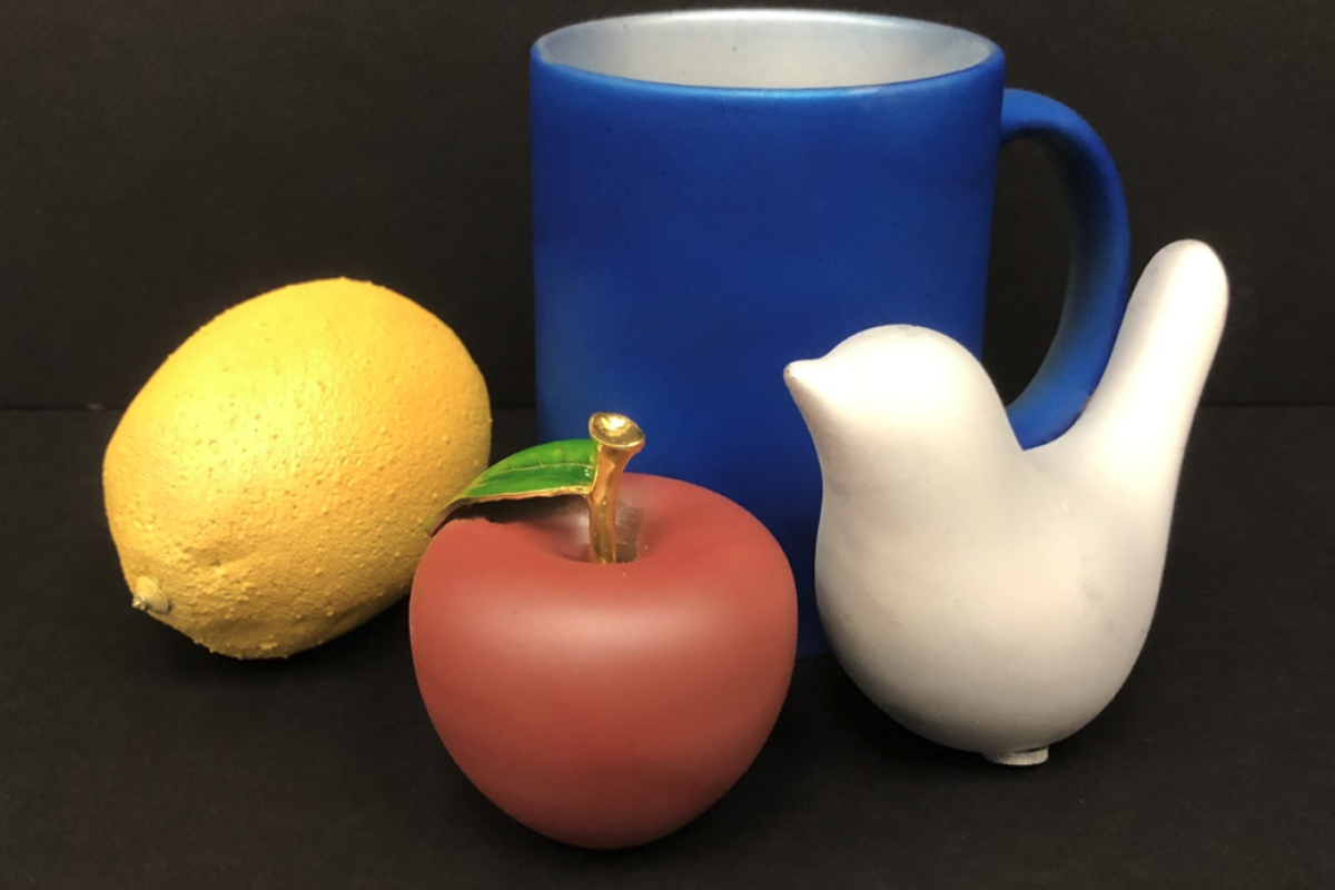 A series of objects painted with the new infrared-blocking paint, showing off the range of colors it can come in