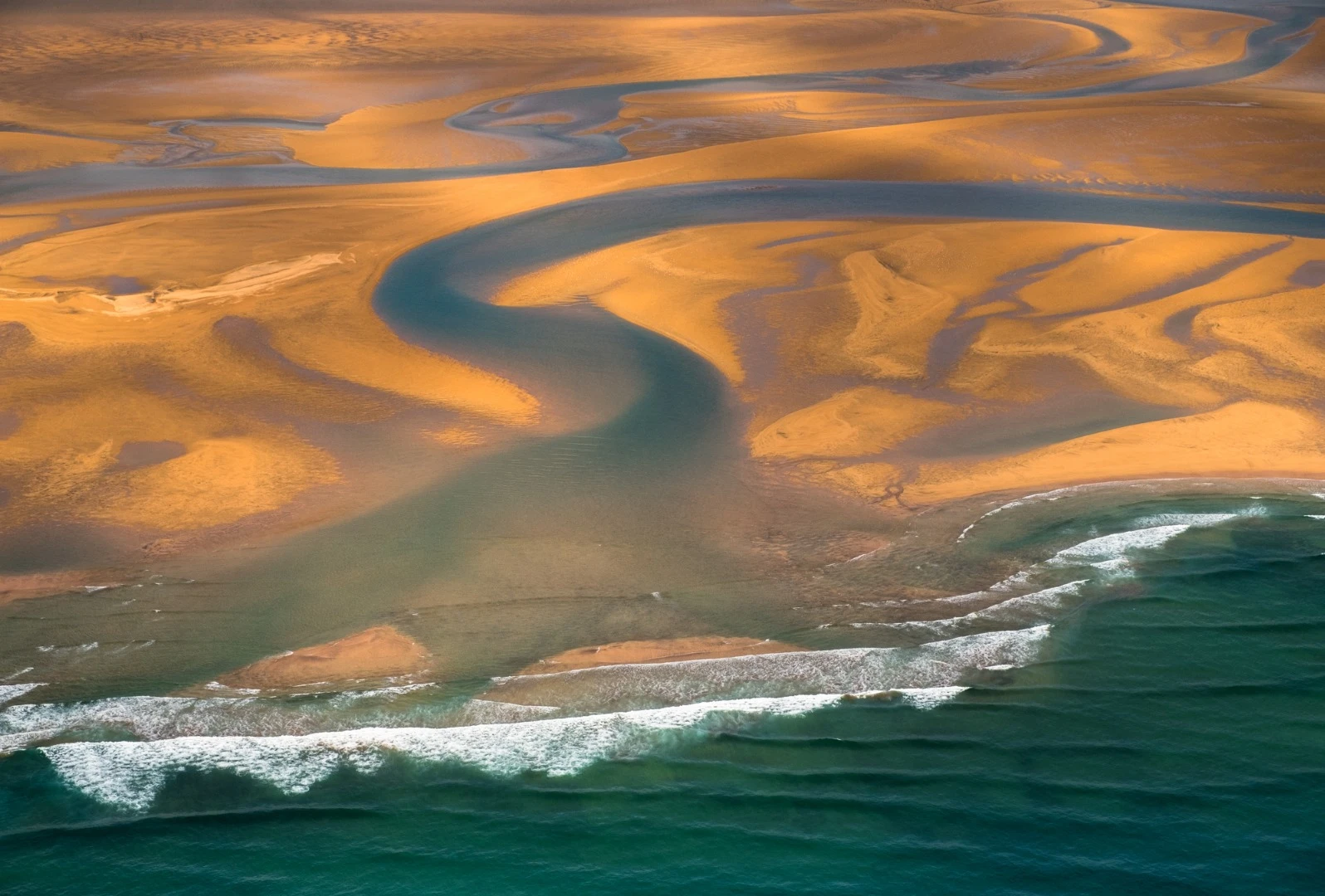 Red sand arctic beach located in the western part of Iceland
