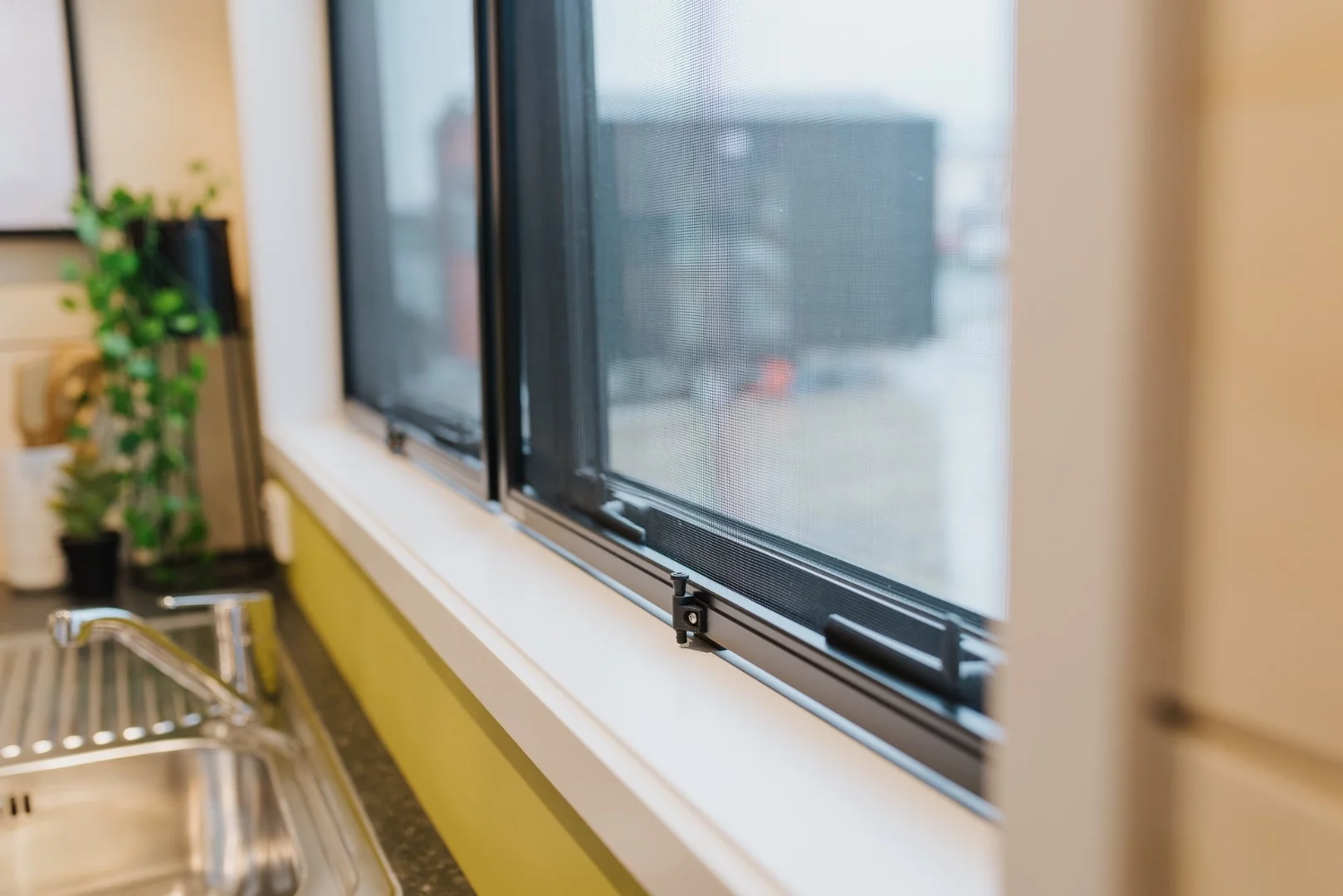 The Green Hill Farm Tiny House's windows have insect screens fitted