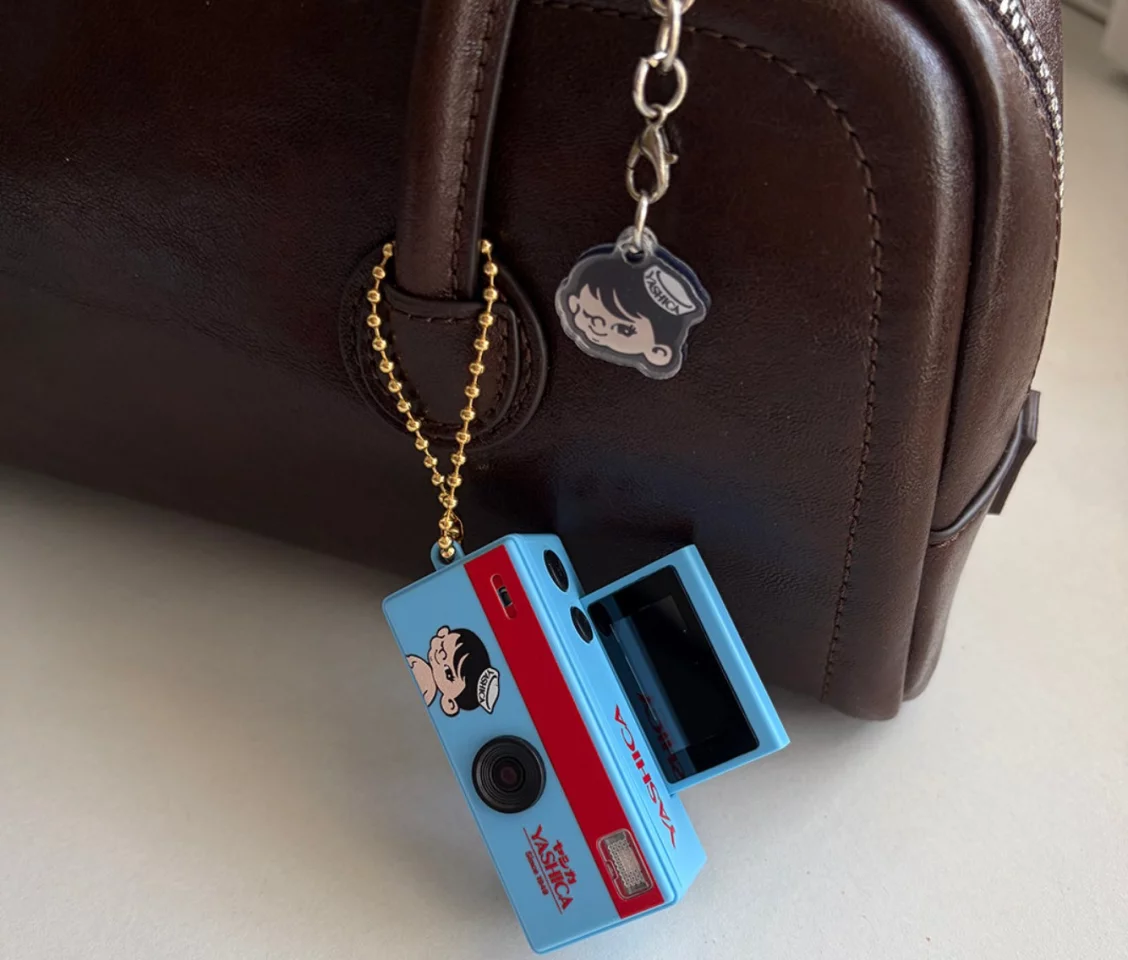 The Yashica Funtastic Keychain Camera’s flip-up screen lets users frame selfies and quick videos, rather than relying entirely on guesswork