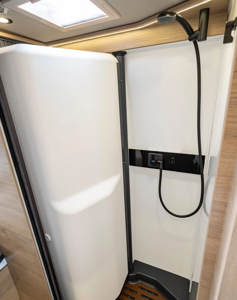 A highlight of the new Knaus Boxtime, the bathroom features a swiveling wall that creates independent shower and toilet setups, keeping one's shower clear of bumping into the sink or toilet