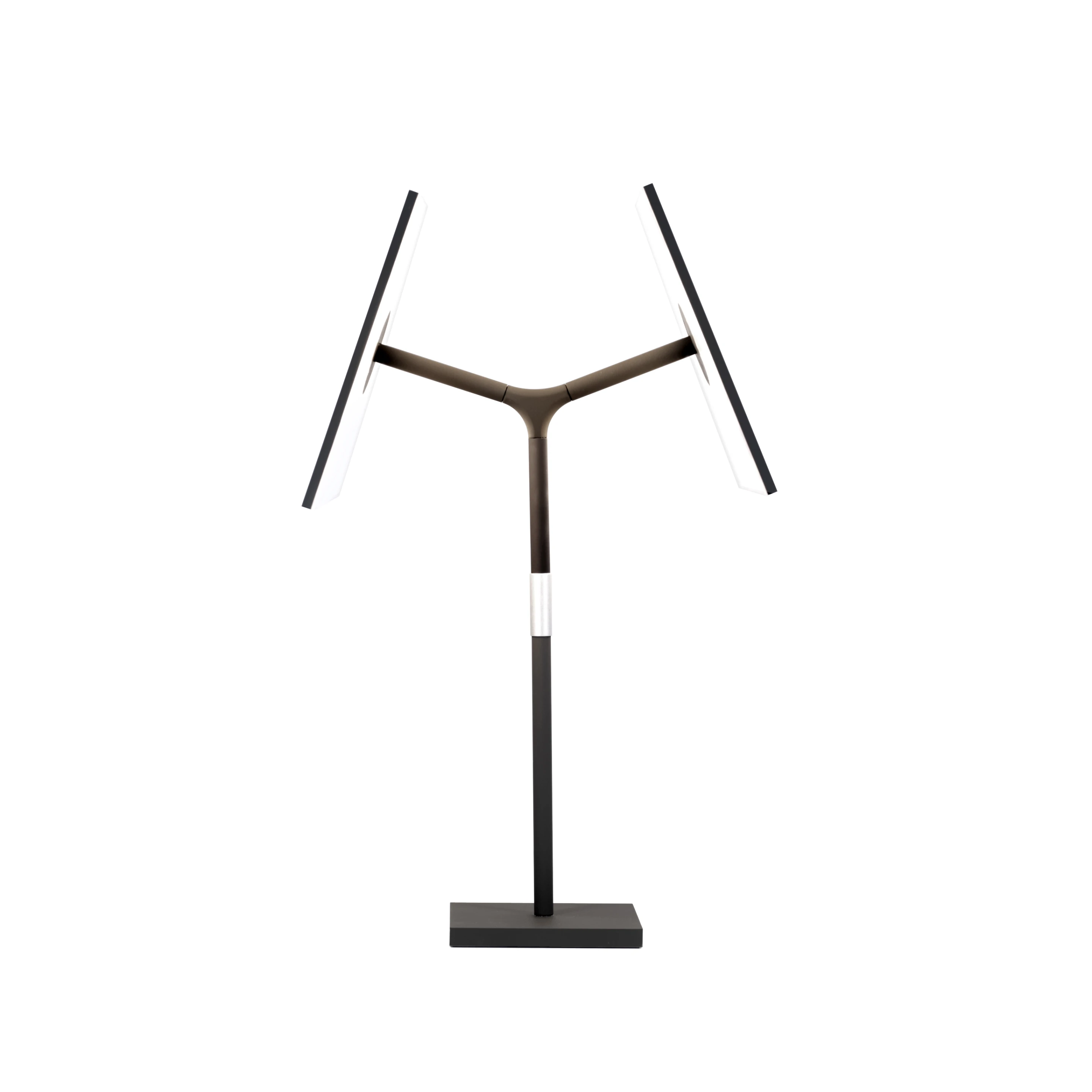 The Symtra instead embeds the light source within the "shade," which is composed of two vertical, parallel, trapezoid planes. Its the inner faces of these shapes that emit light; the outside is finished in pitch black