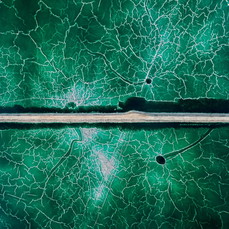 Textures at an abandoned pond used for the disposal and stacking of phosphogypsum with shallow, but highly toxic radioactive green water in Huelva, Southern Spain