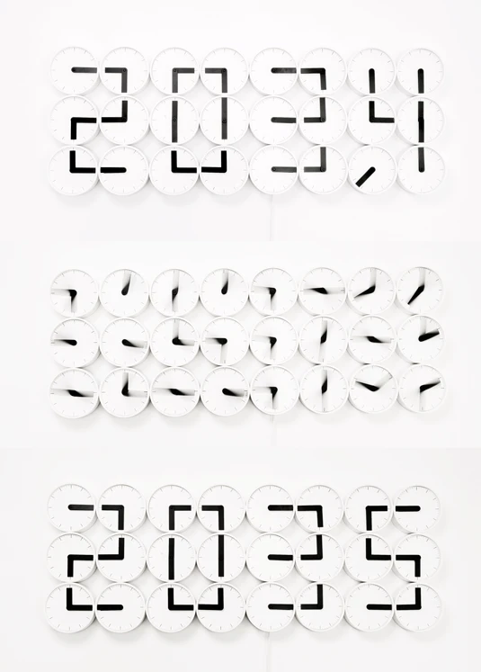 The Clock Clock from Humans Since 1982 in action: showing 20:34, 20:35, and the transition between the two