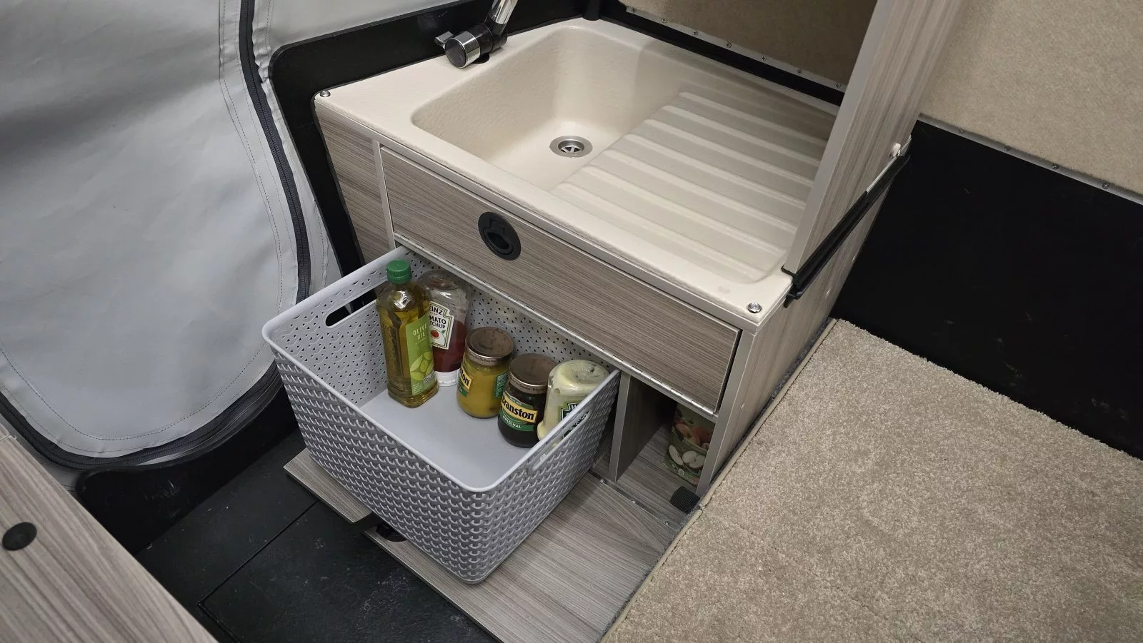 Both Dashaway ECT models include a sink on the lefthand side of travel