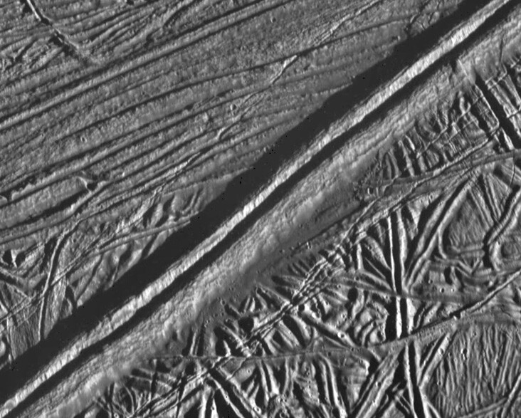 A close-up composite image of ridges and cracks in Europa's surface captured by the Galileo spacecraft in 1997 (Image: NASA/JPL)