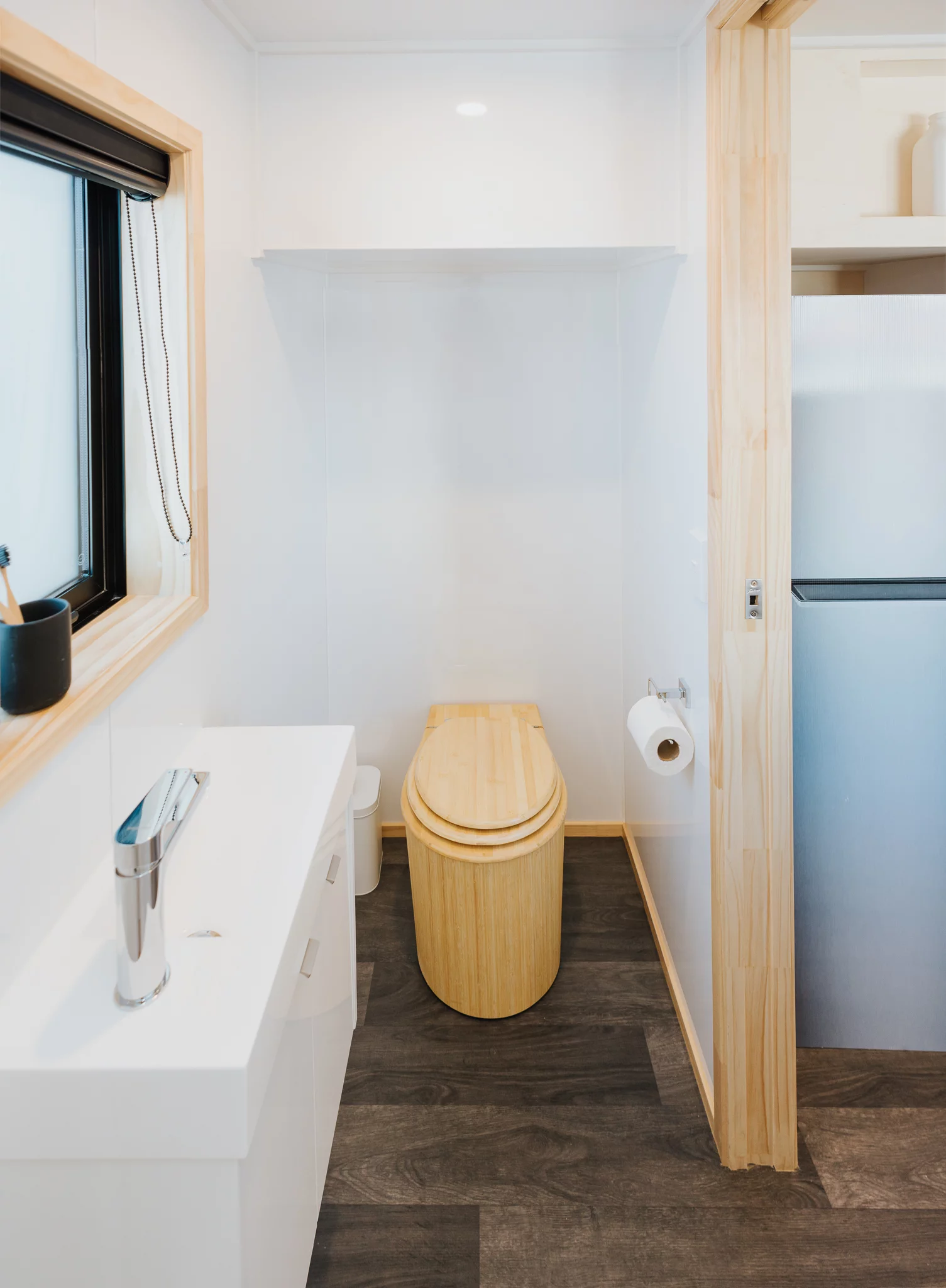 The Dreamweaver Tiny House's bathroom includes a composting toilet