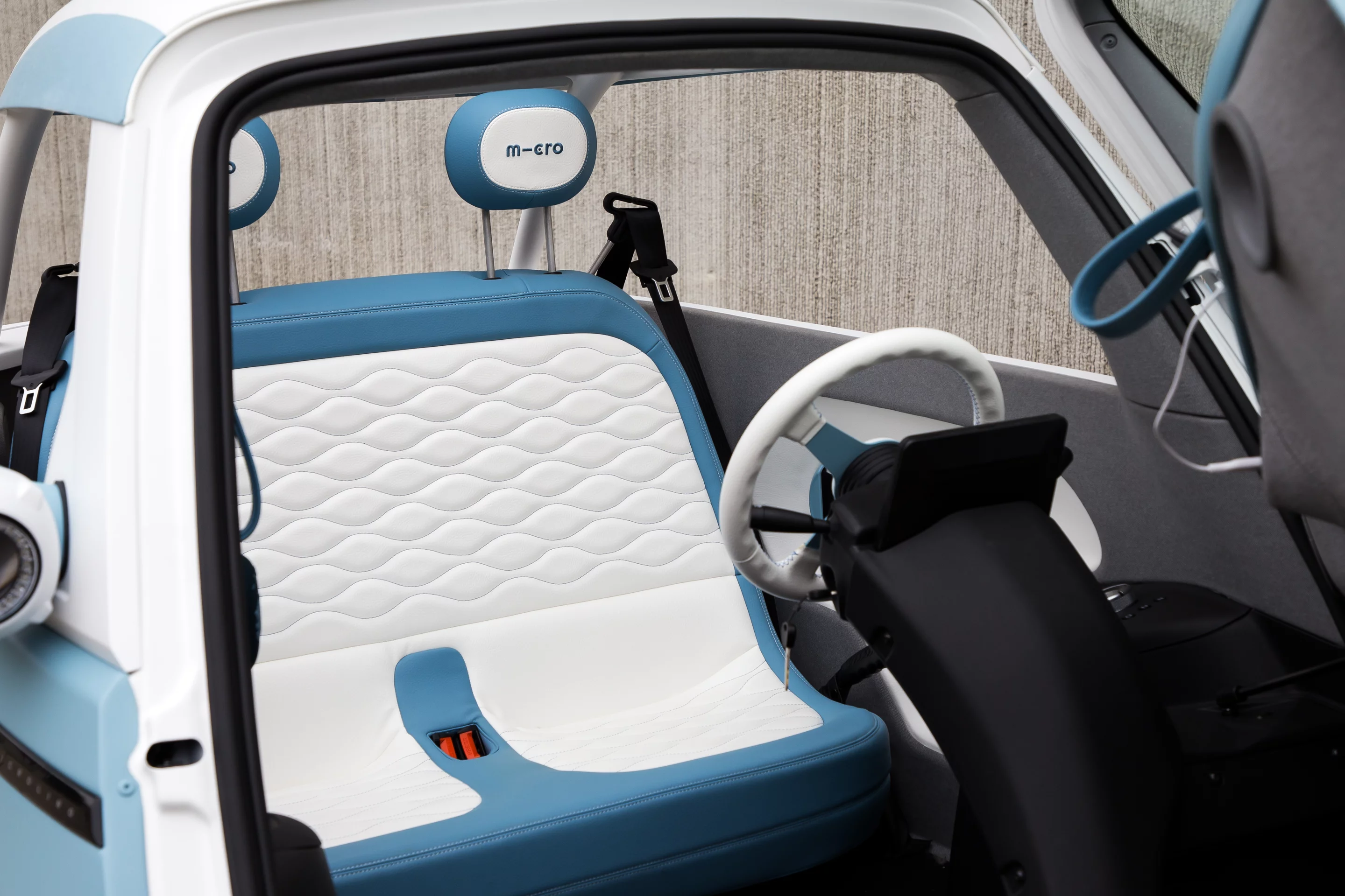 The Microlino Spiaggina electric micro car comes with a moisture-resistant vegan leather interior