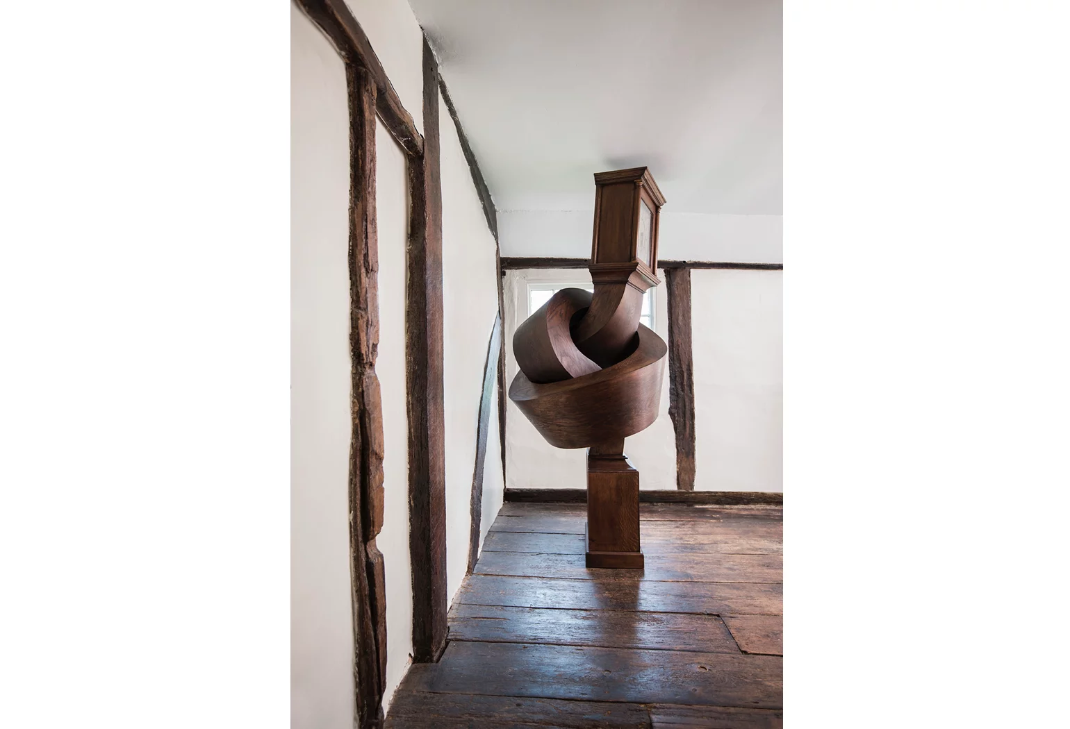 Growing up gets me down contorts a grandfather clock into an unlikely position