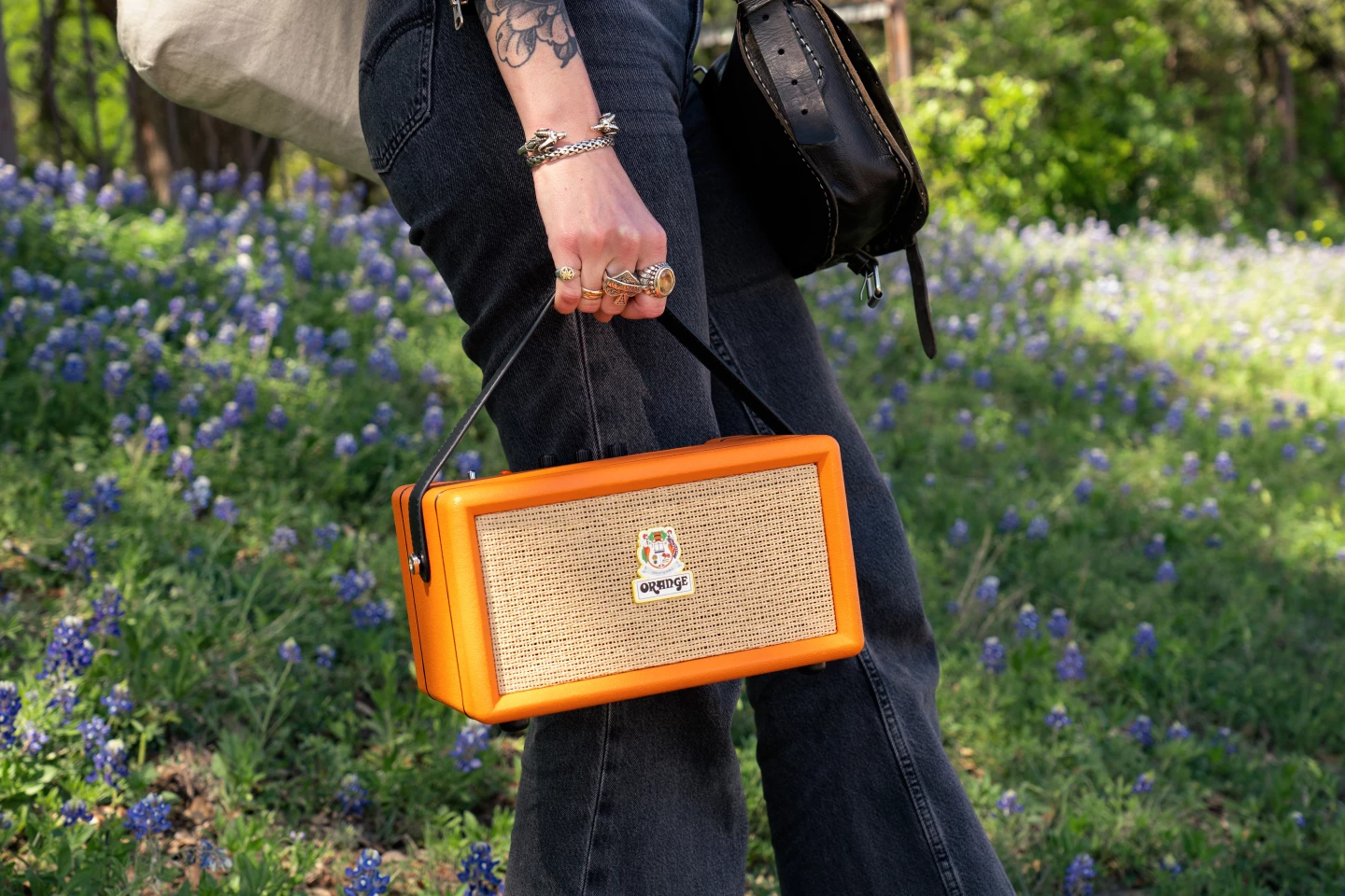 The Orange Box sports guitar-like strap buttons, a top panel that has the look of the company's amplifiers, a Tolex-like cabinet covering and a basketweave speaker grille