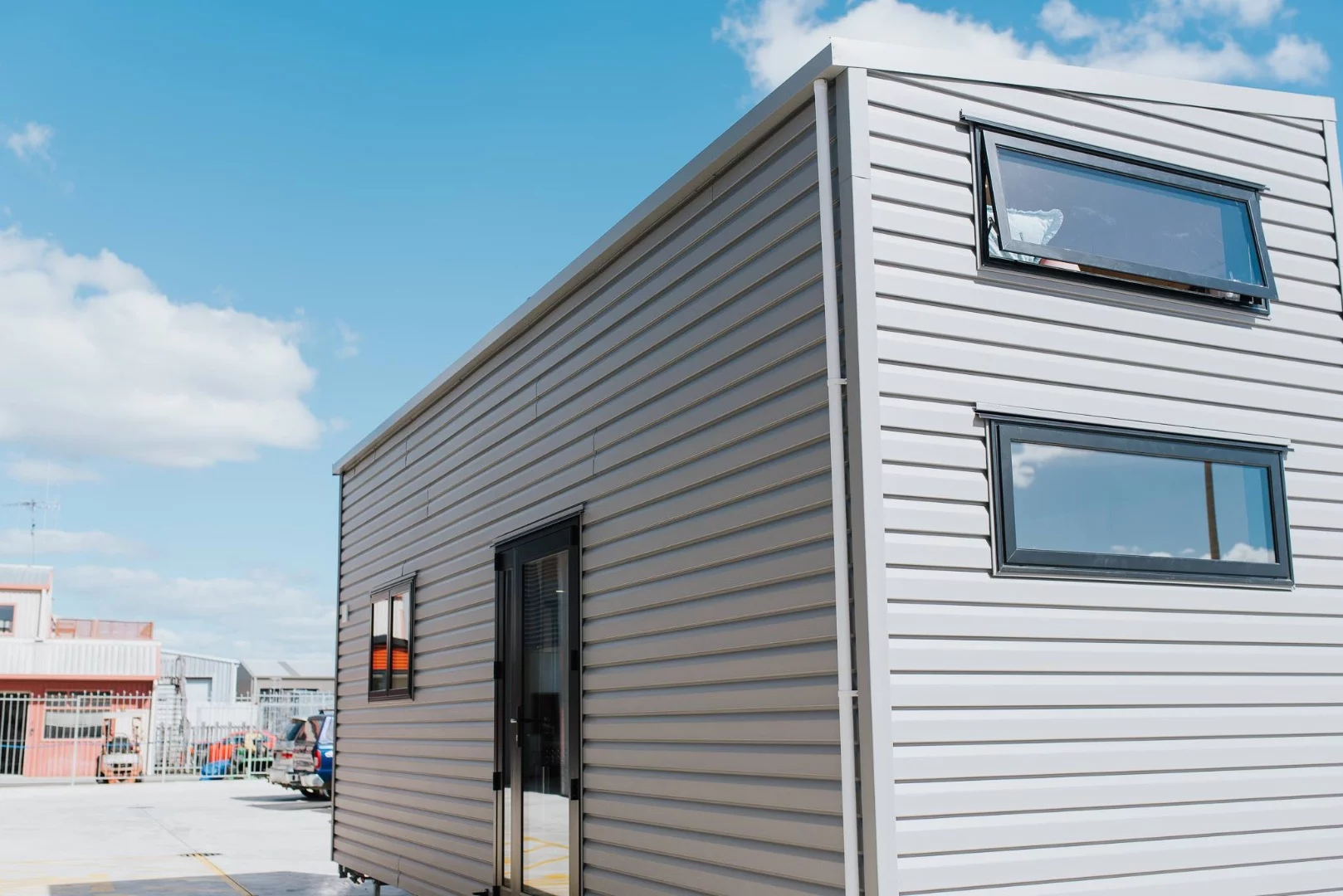 La Sombra Tiny House is clad in vinyl siding