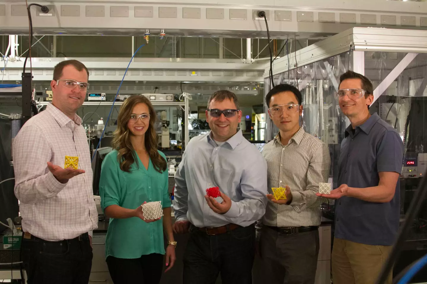 The LLNL research team with examples of microstructure cells (Image: LLNL)