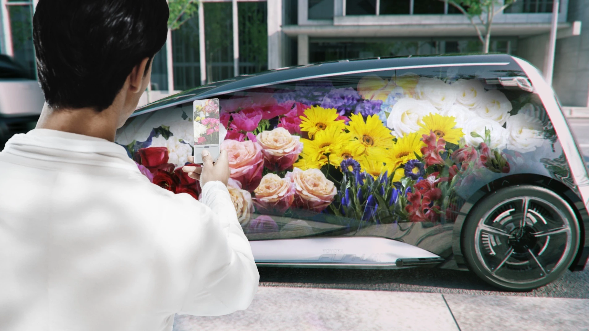 The Fun-Vii stands for "Fun Vehicle interactive internet." The only image released so far shows a man with pictures of a car on his mobile phone, presumably projecting the image onto the side of the car.