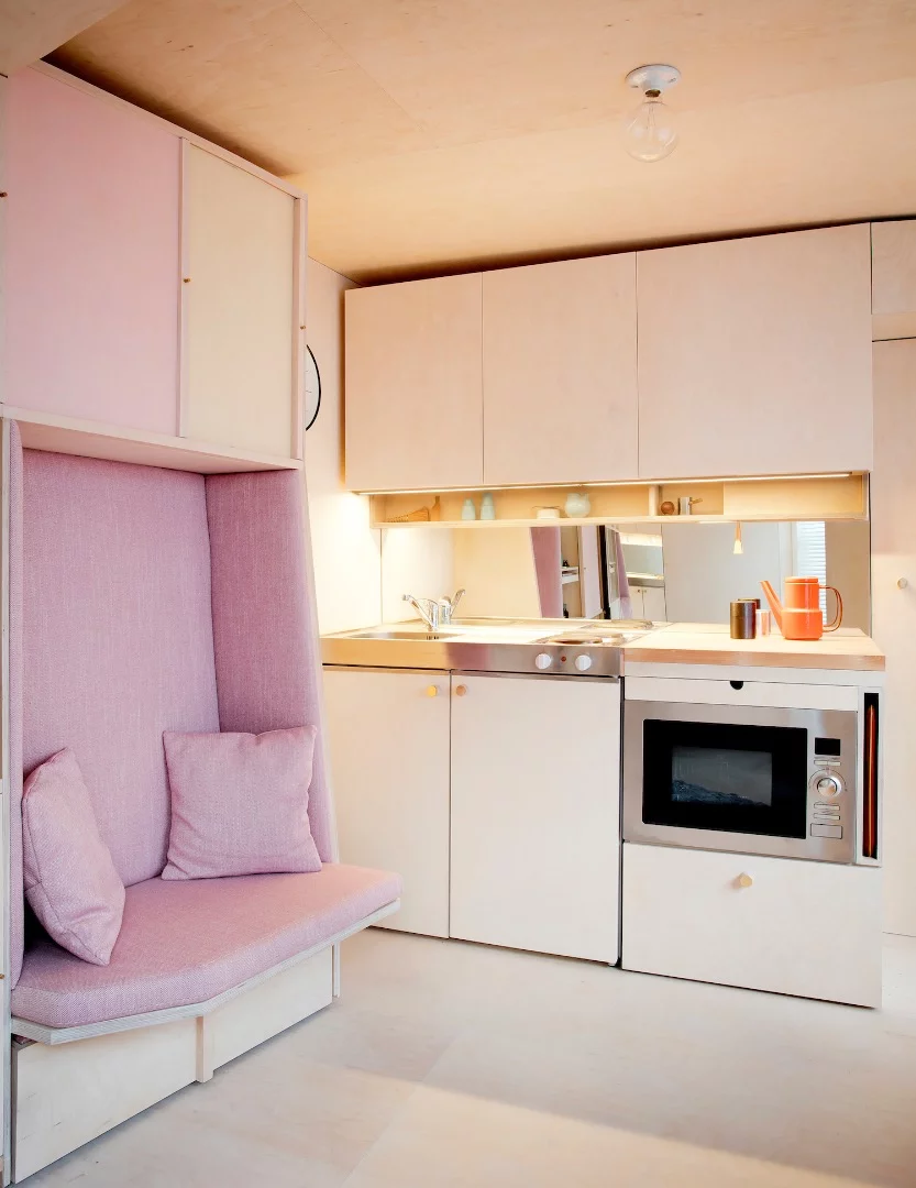 The 13 sq Metre House's small couch and kitchenette