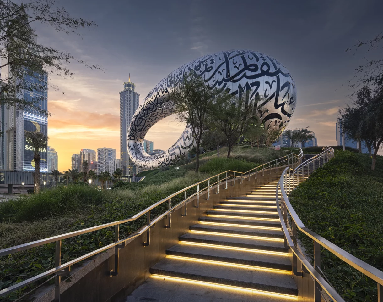 The Museum of the Future's stainless steel exterior features intricate calligraphy with inspirational quotes, such as "The future belongs to those who can imagine it, design it and execute it. It isn't something you await, but rather create"