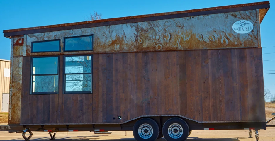 The tiny house looks a little steampunk with its rusted steel cladding