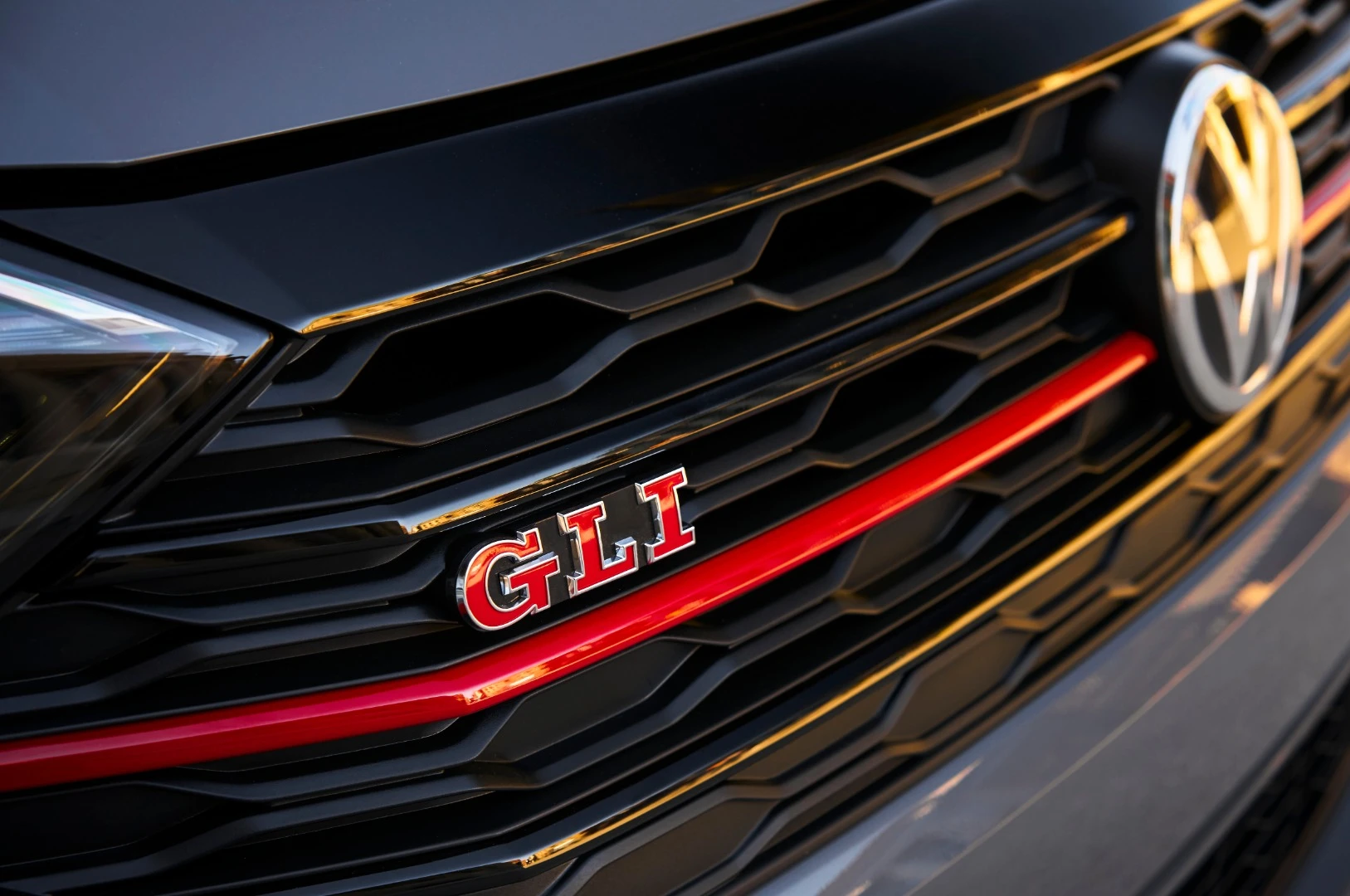 A black honeycomb grille with its red accent line are some of the visual cues for the 2019 Volkswagen Jetta GLI model