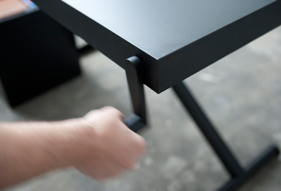 The XTable legs are raised and lowered using a simple hand crank positioned on one corner