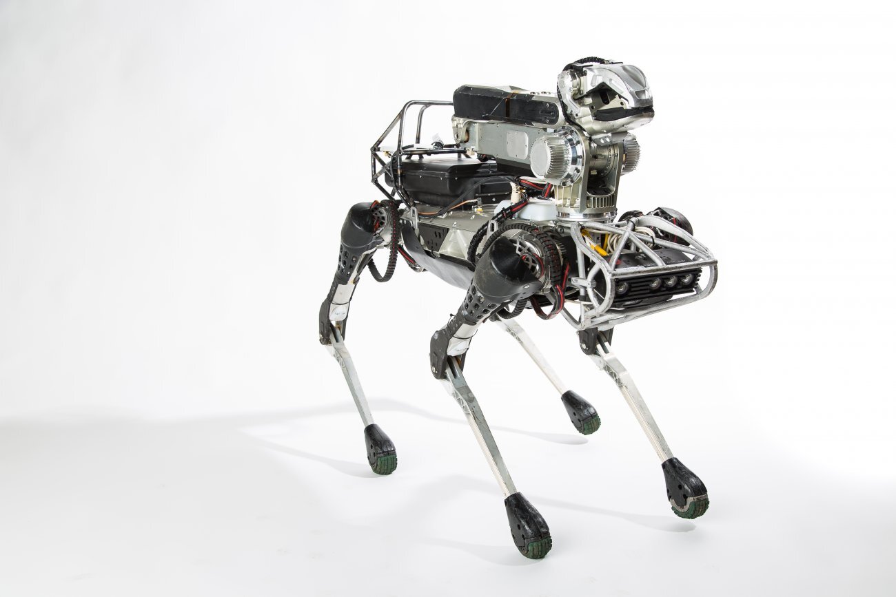 The previous SpotMini with manipulator arm