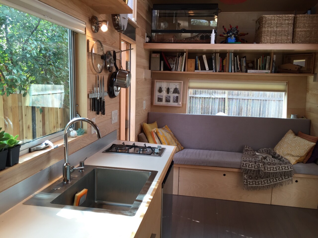 The main living space contains a kitchen and lounge area