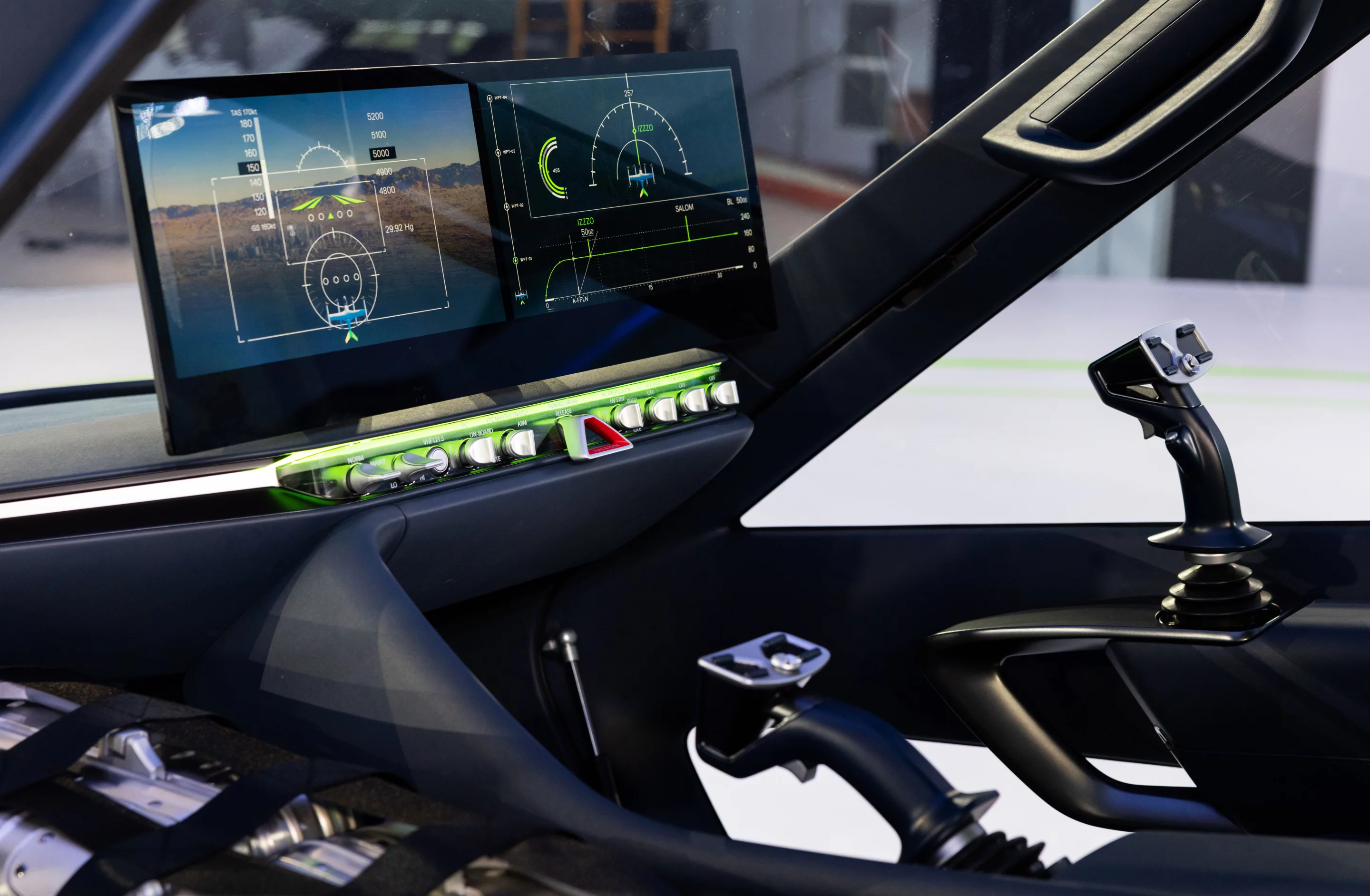 Sweet-looking cockpit shows a two-joystick control system and large touchscreens