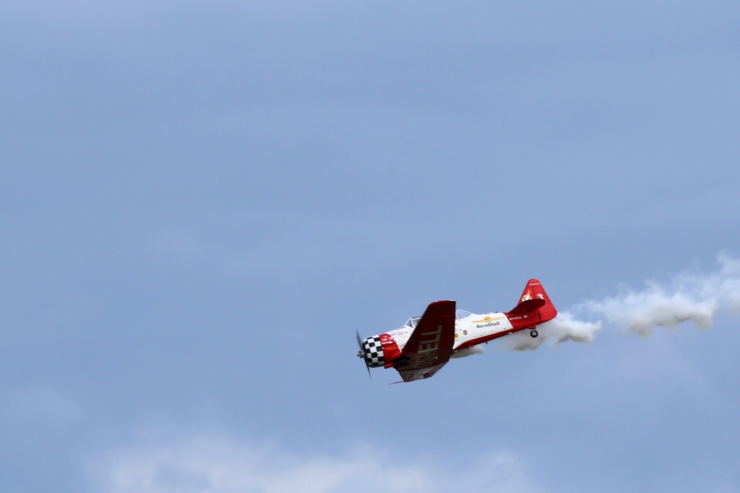 A Honda badged aerobatic plane performs at EAA AirVenture 2014 (Photo: Angus MacKenzie/Gizmag.com)