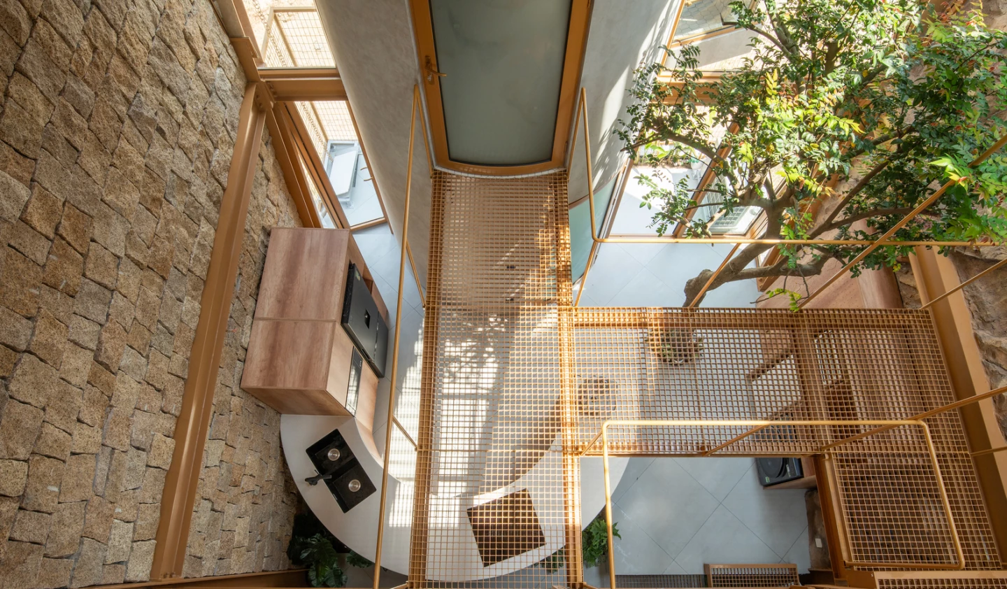 Stones from the excavation become interior art and garden paths – nothing wasted