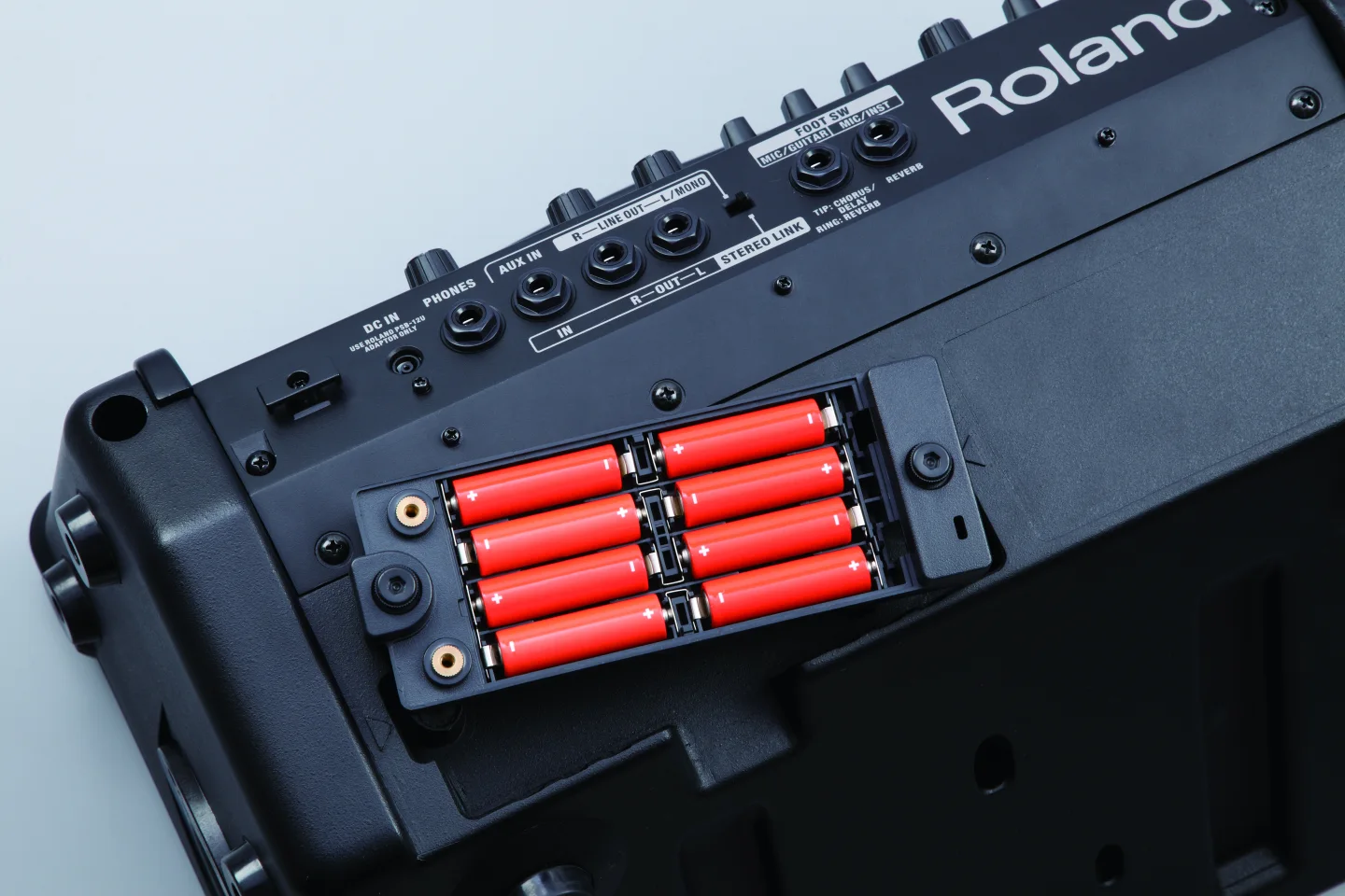 The Eco (10 W) mode promises up to 20 hours of outlet-free play from eight AA-sized Ni-MH batteries