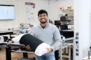 PhD researcher Malindu Ehelagasthenna with the smart pillow sleeve that he invented