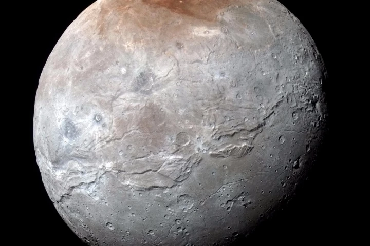 Image of Pluto's moon Charon, taken by New Horizons. This new high-resolution image taken by the spacecraft's Ralph/Multispectral Visual Imaging Camera (MVIC) contains geological features down to a scale of 1.8 miles (2.9 km)