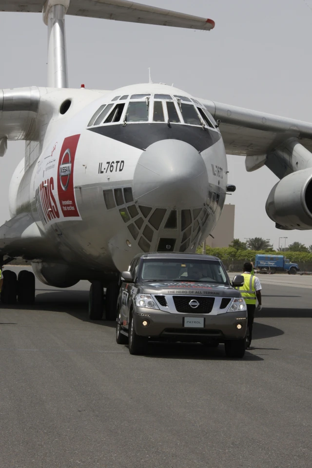 The Nissan Patrol towing the 170.9-ton cargo plane to claim the "heaviest object pulled by any production vehicle" Guinness World Record