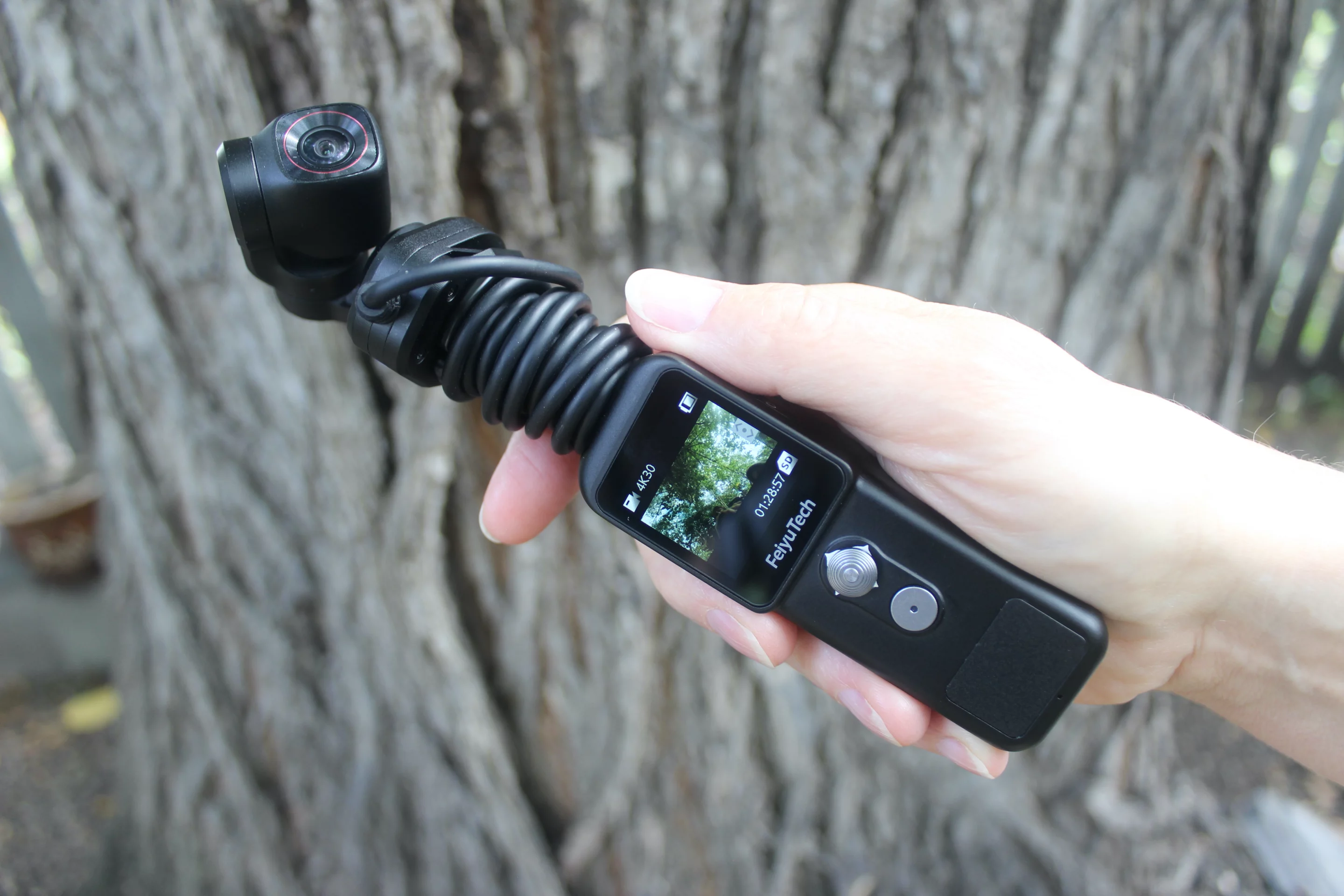 The Feiyu Pocket 2S can be used as one handheld unit, or its hard-wired camera/gimbal unit can be pulled off and mounted on a helmet, etc.