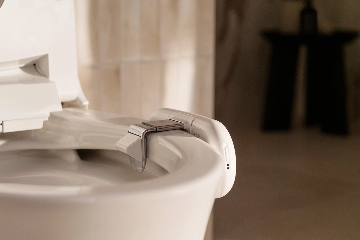 The Dekoda clamps on to the side of most toilet bowls - interestingly, it won't work with dark colored commodes
