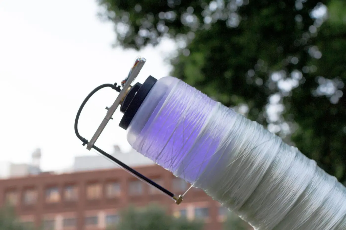 MIT's Fiberbots sport a spooling mechanism that wraps their bodies in fiber and resin