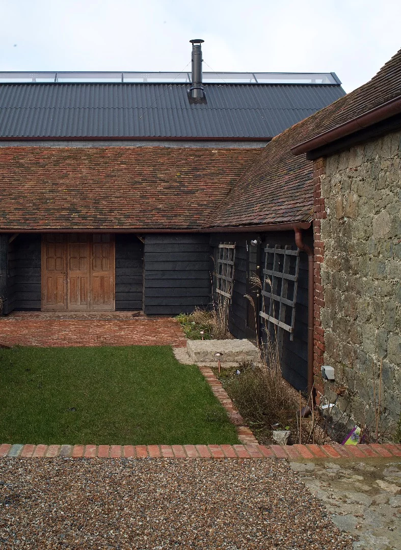 Ancient Party Barn comprises a cluster of agricultural buildings, most notably an 18th Century threshing barn